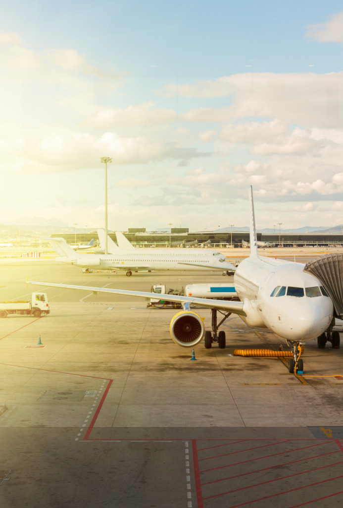 white plane at airport waiting for departure